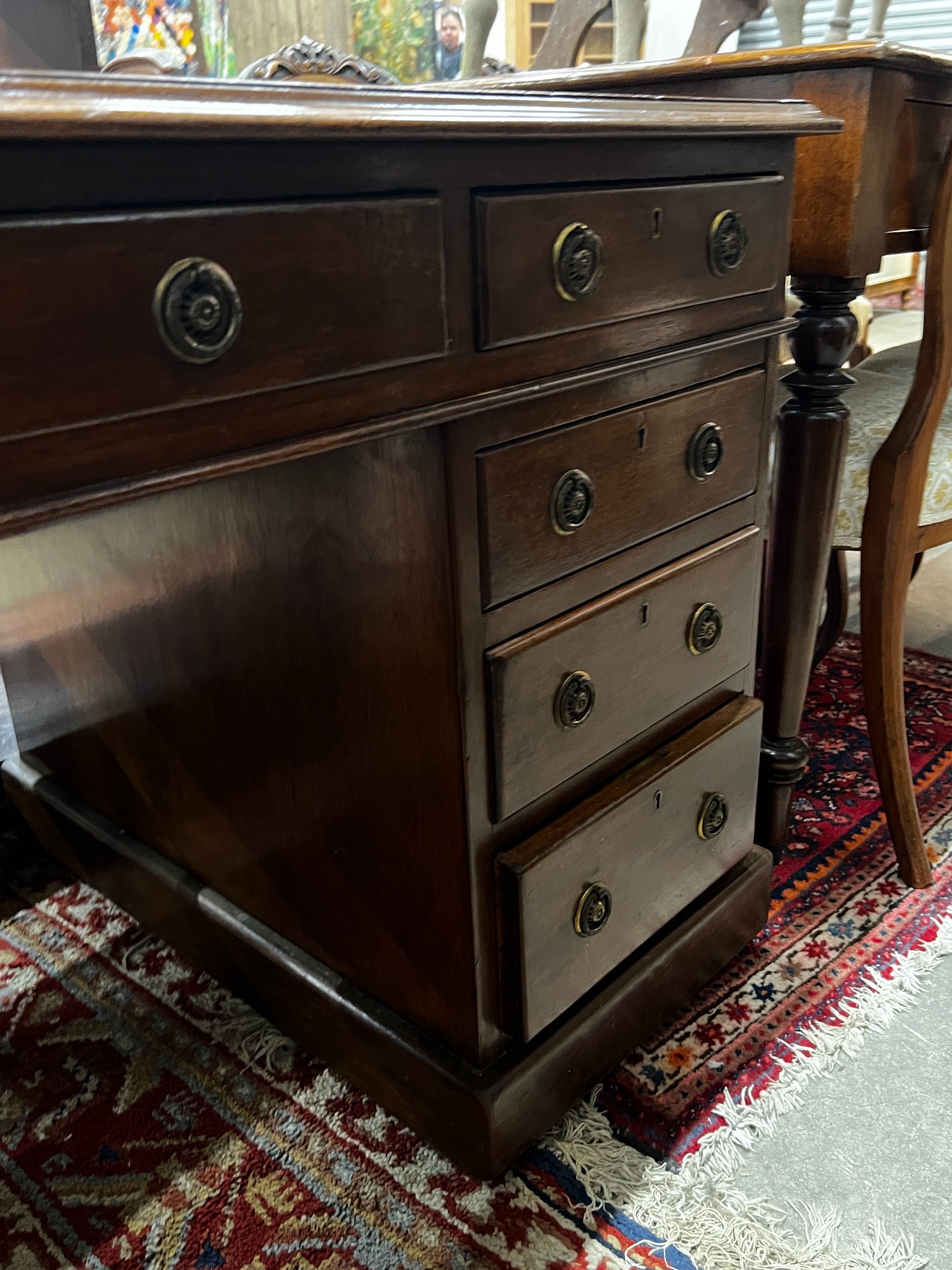 An early 20th century mahogany leather topped pedestal desk, width 137cm, depth 75cm, height 74cm